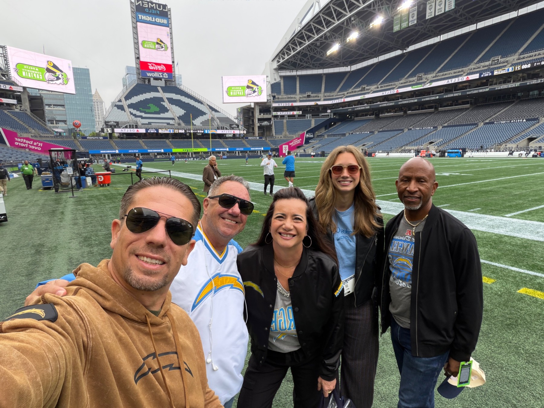 Lenny with a group on the field at a Chargers game experience